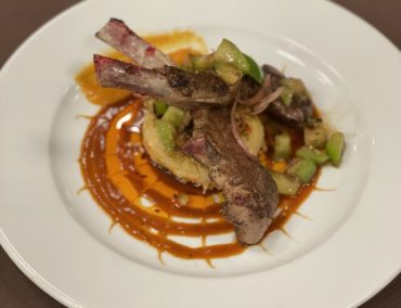 2022 Finalist - Pan Seared Rack of Lanb, over Southwest Hominy Cake, Topped with Tomatillo and Pickled Shallott Relish